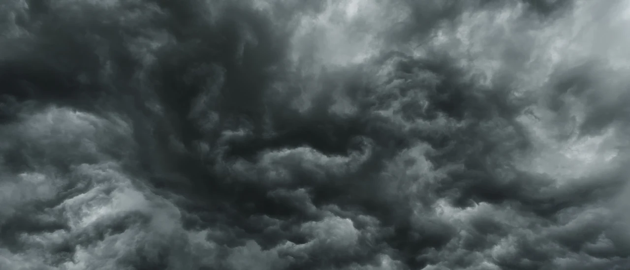 Dark storm cloud deck rolling in ahead of severe weather — representative
